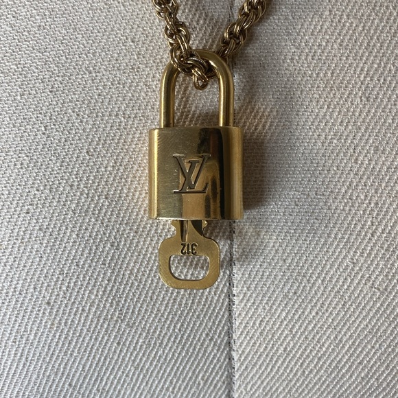 Authentic Louis Vuitton Lock & key # 312 on a Antique Gold Tone Necklace - Picture 3 of 5